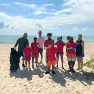 Police Sergeant Yema, Sunbeam Properties & Development Vice President Ryan Goggins, and Police Officer Barrios with campers Aylin Tello, Silas Suverain, Nathon South, Jayden Aaron, Betsy Petit, Jessen Blank(Back Corner) Jonathan Henry